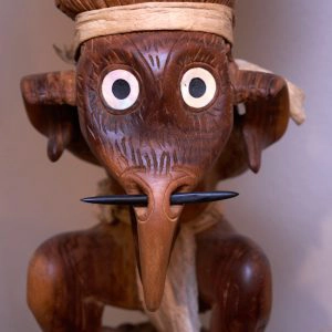 statue-made-out-of-wood statue made out of dark wood