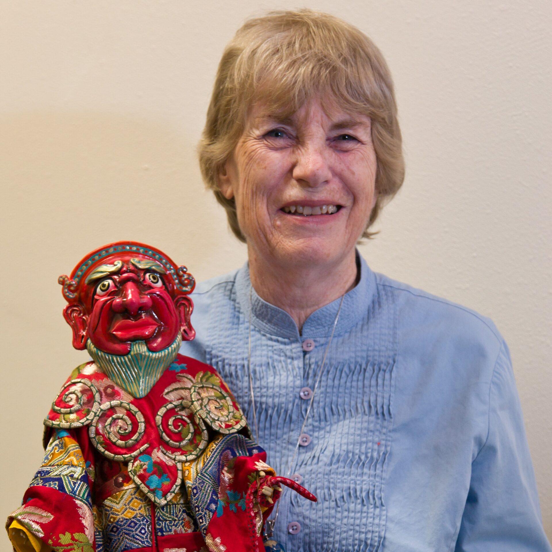 two small dolls, wearing kimonos